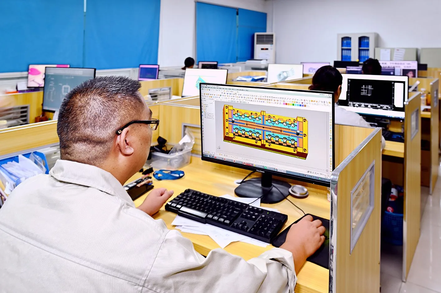 DFM review: engineer checking progressive die layout CAD at ISTAMPING